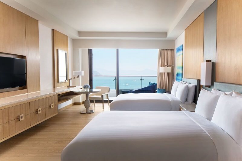 hotel headboard design with integrated bedside furniture